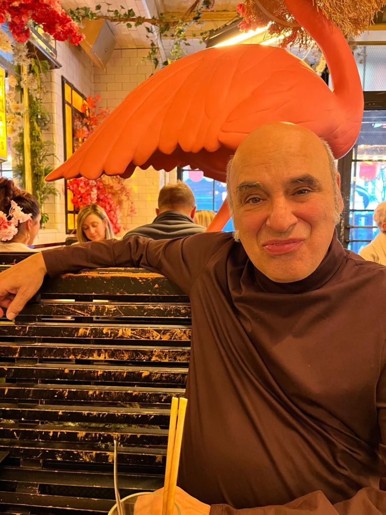 Enjoying dining in a Parisian bistro with pretty flamingos